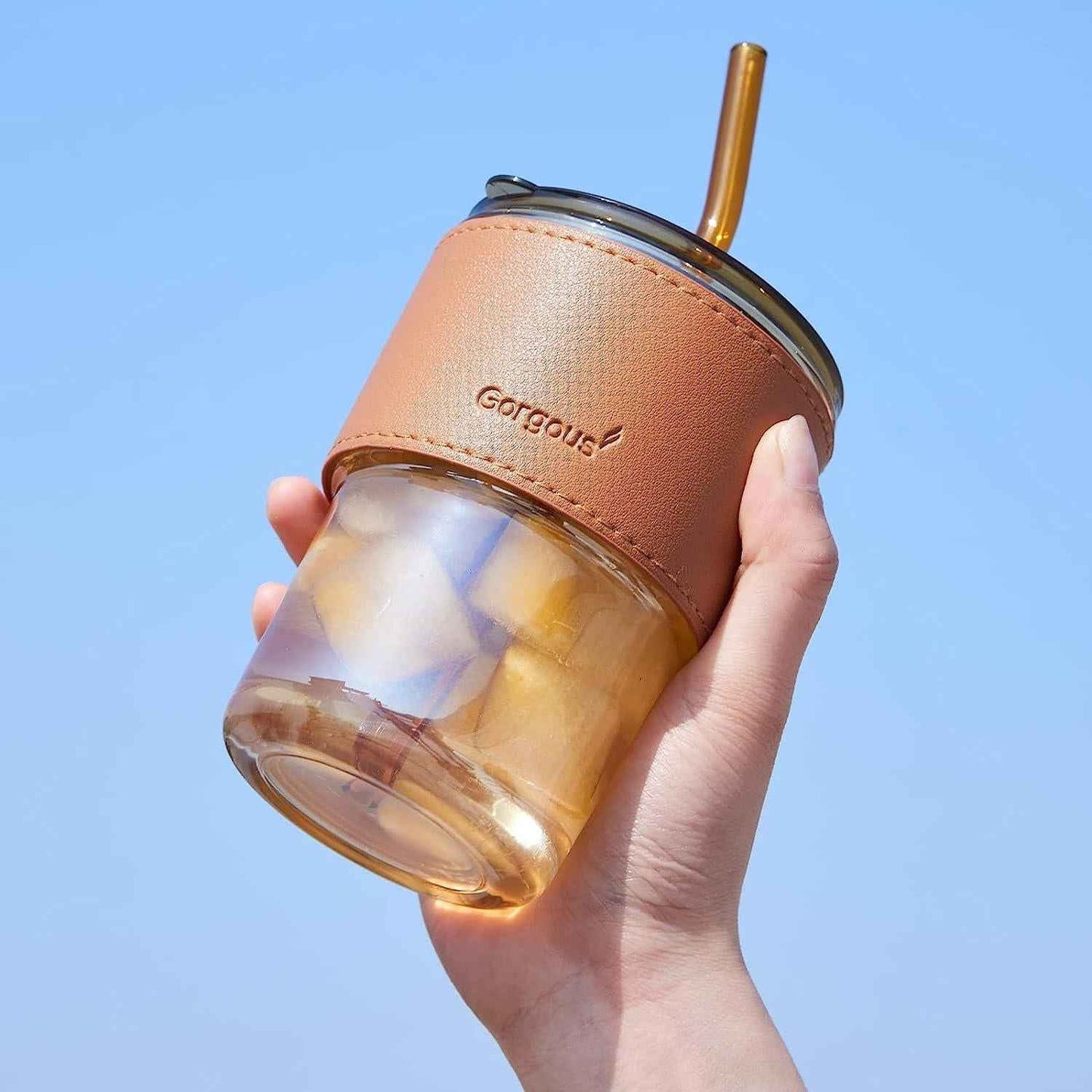 Over glass water bottle with straw